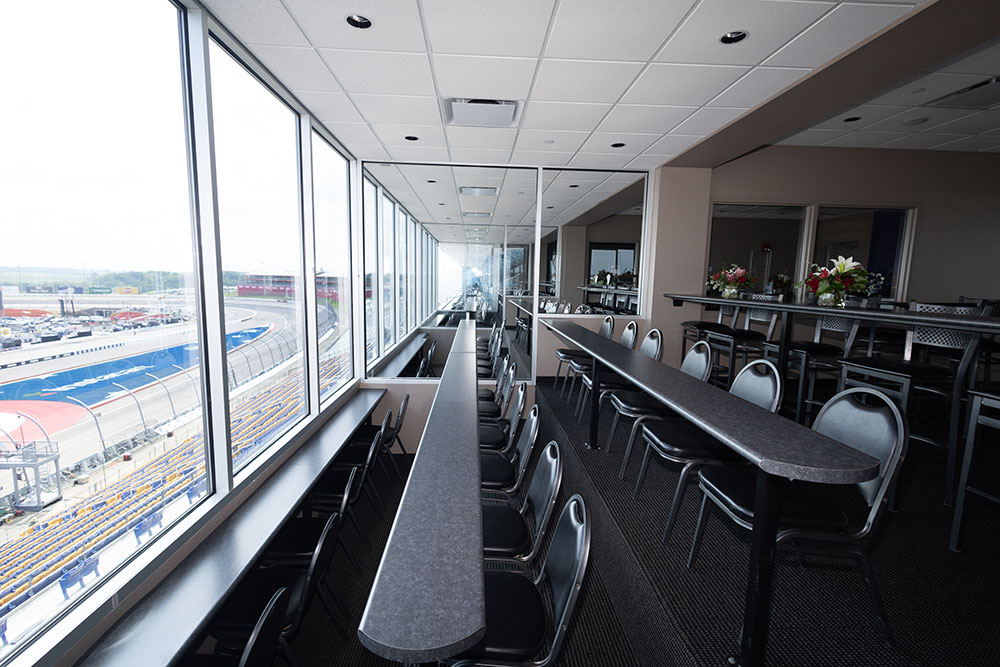 The view of seating in a suite over looking the front straight